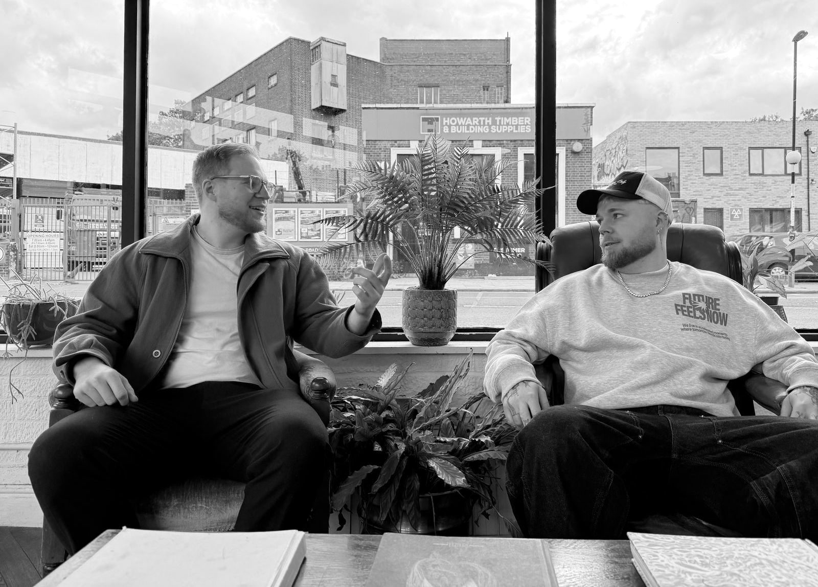 The two founders talking in a shop